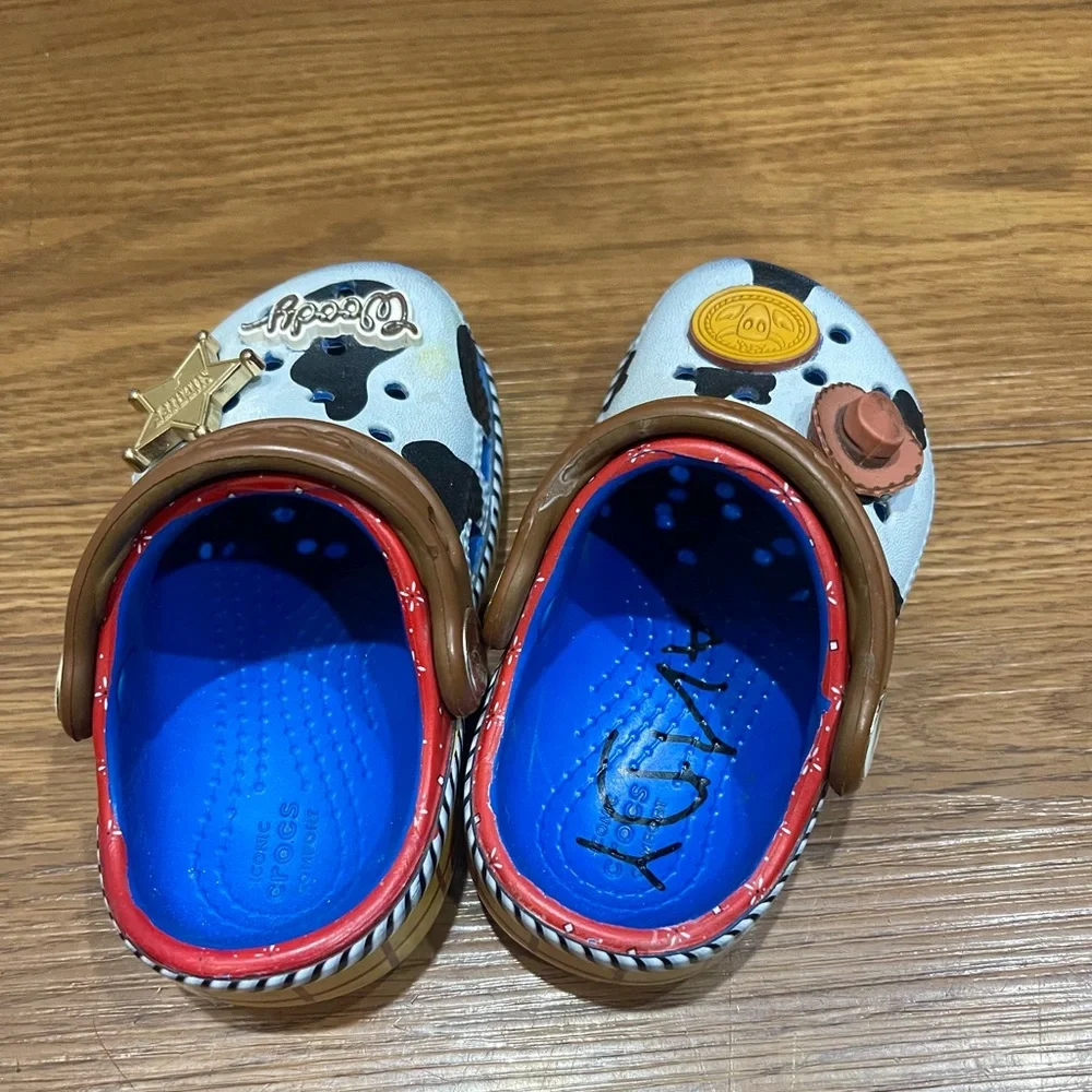 CROCS Kids Woody Cow Print Clogs in White, Black & Brown